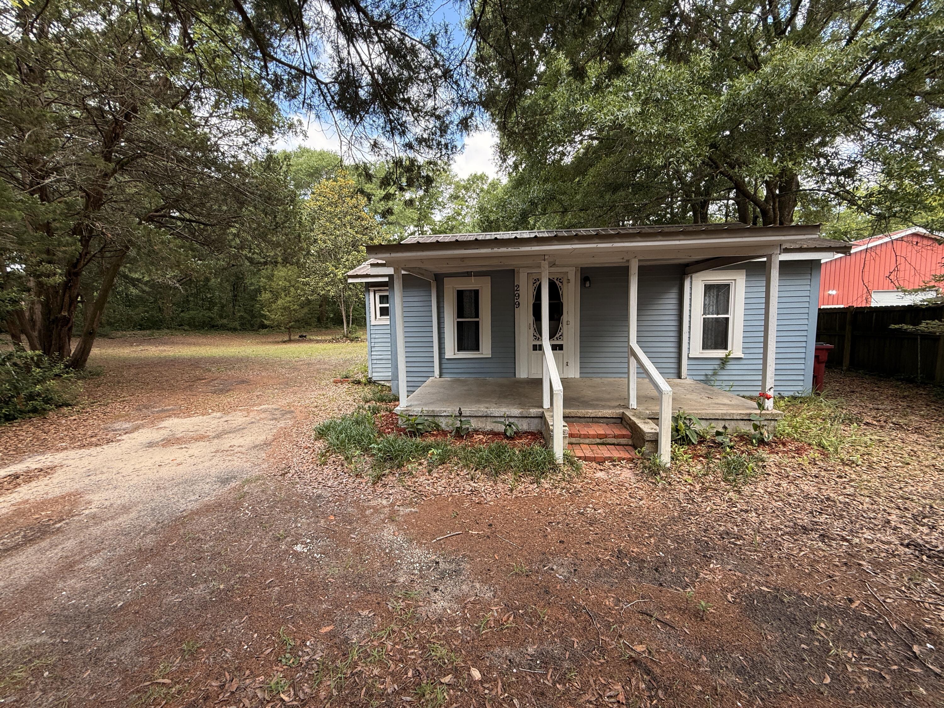 299 Carl Place Crestview, FL 32539 - Photo 2 of 37 a house with trees in the background