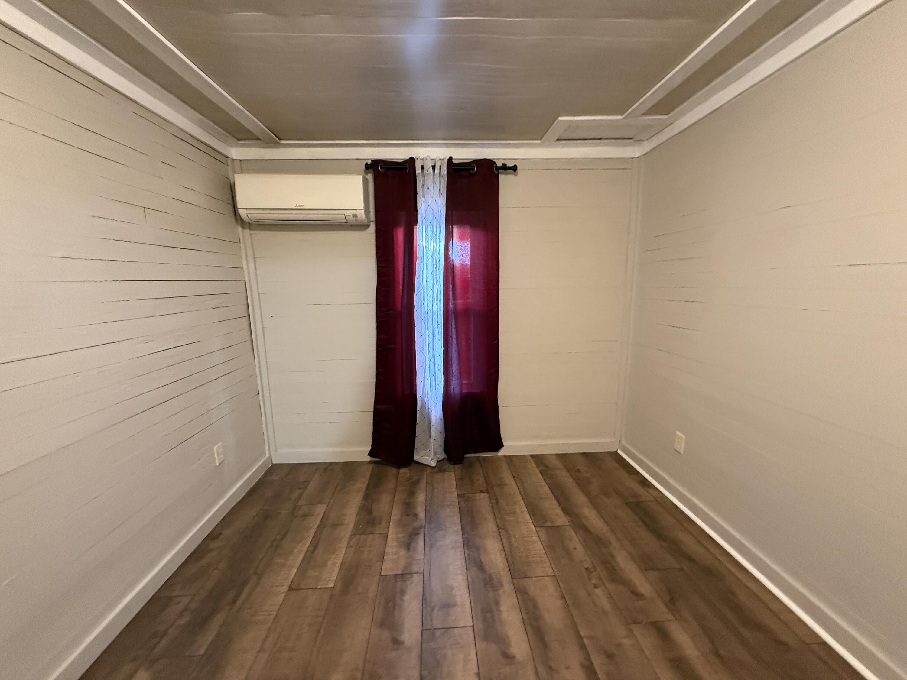 299 Carl Place Crestview, FL 32539 - Photo 22 of 37 a view of a room with wooden floor and small walls