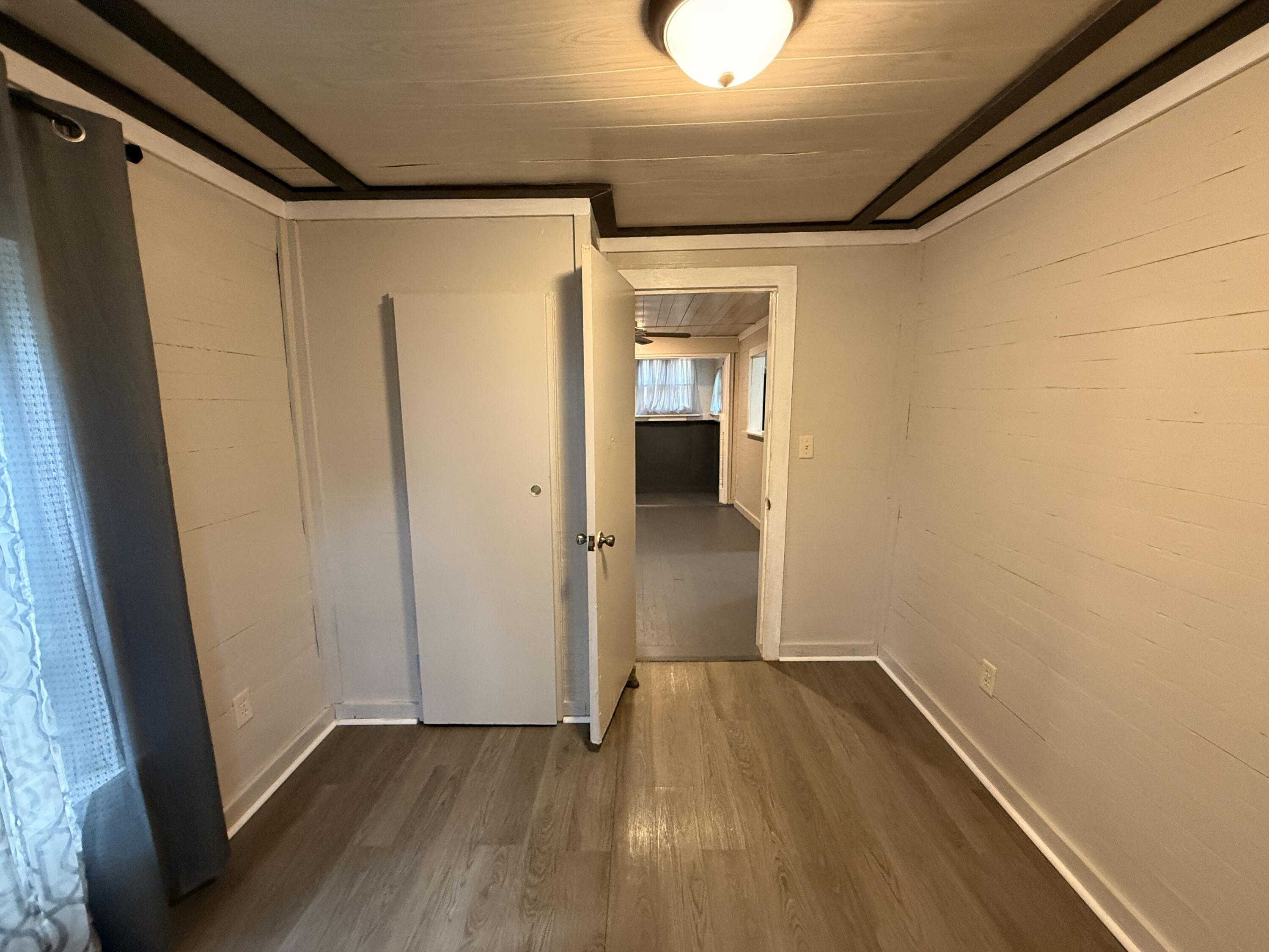 299 Carl Place Crestview, FL 32539 - Photo 27 of 37 a view of hallway with wooden floor