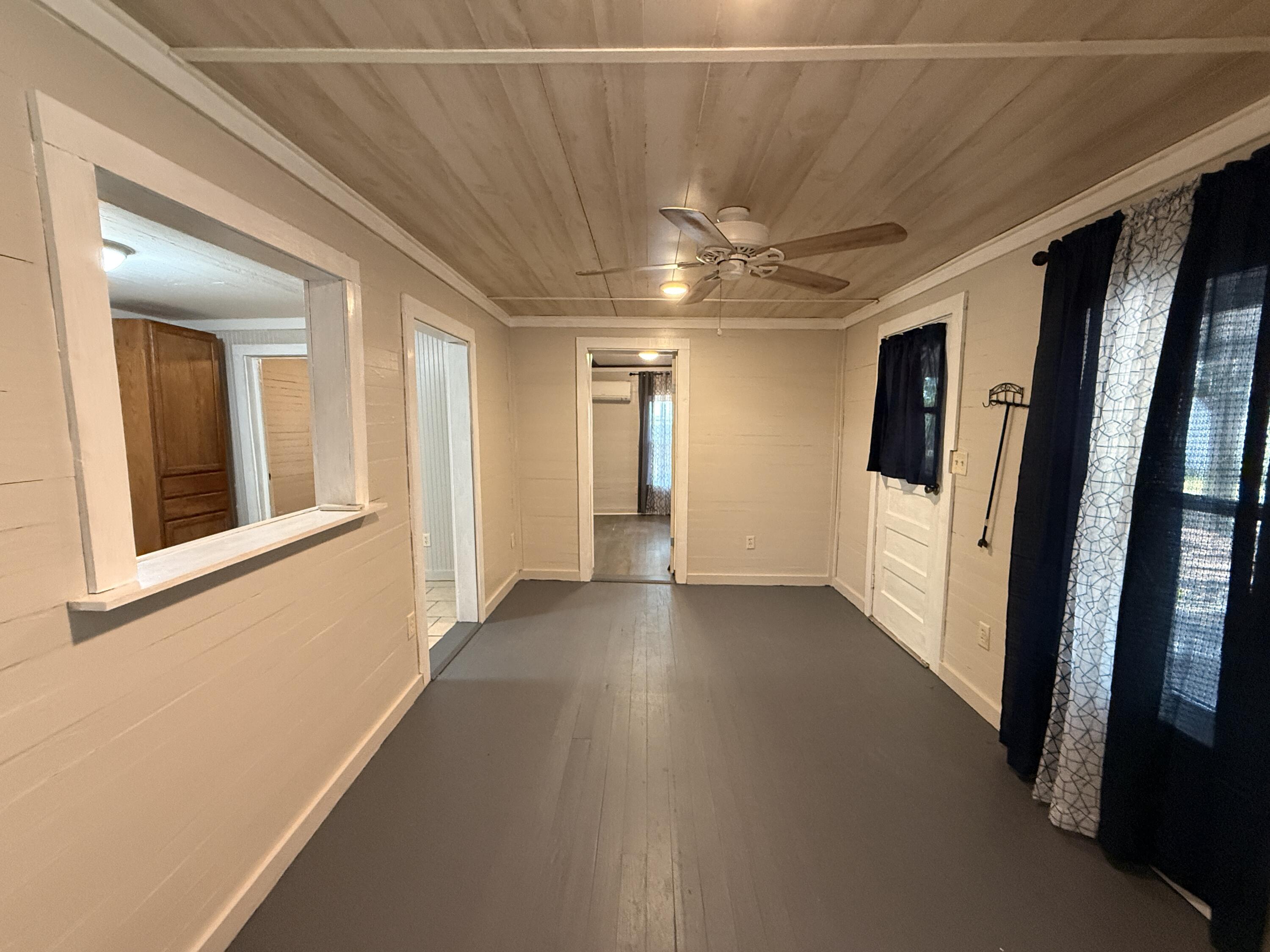 299 Carl Place Crestview, FL 32539 - Photo 28 of 37 a view of gallery with wooden floor