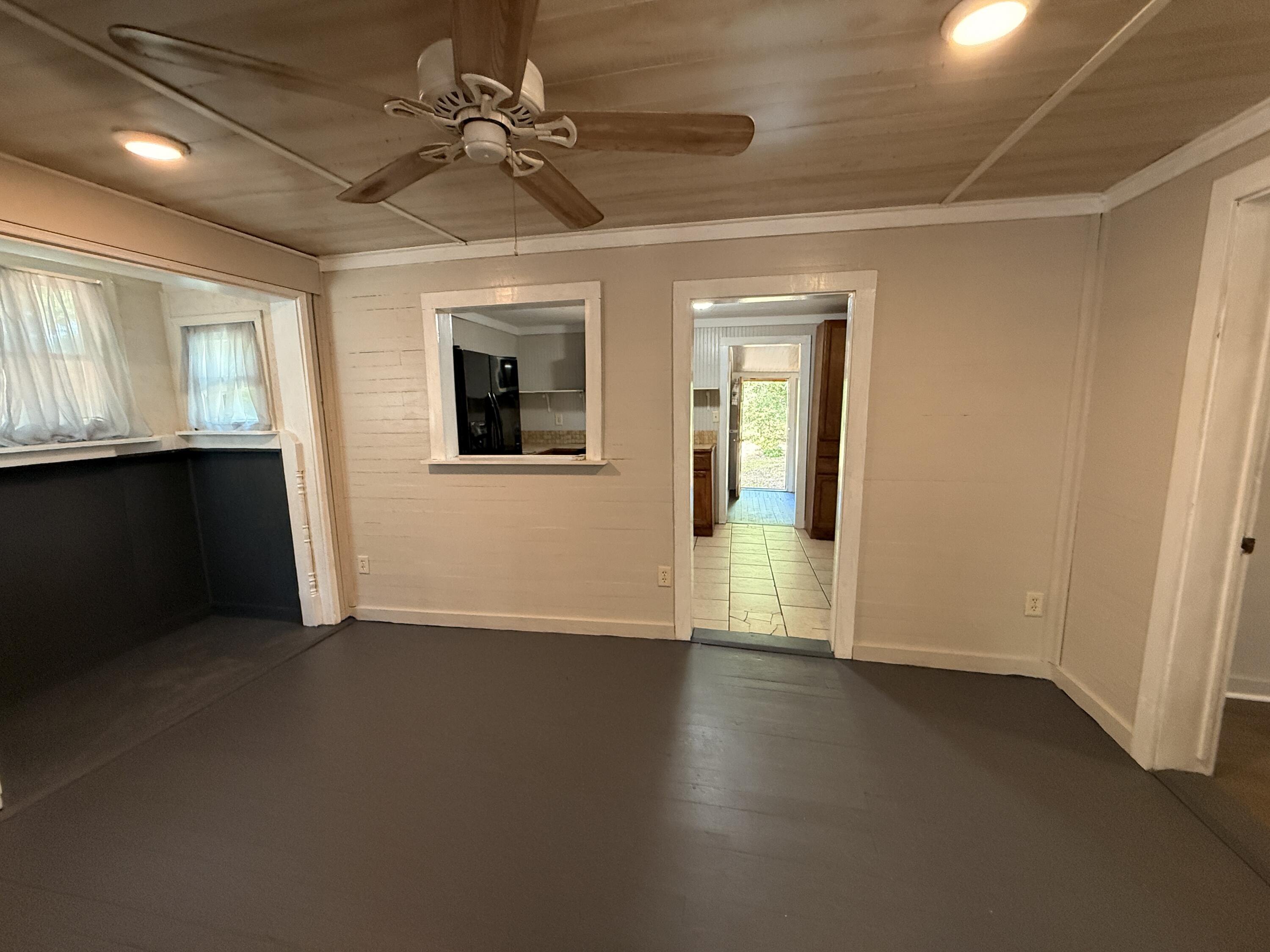 299 Carl Place Crestview, FL 32539 - Photo 30 of 37 an empty room with wooden floor and windows