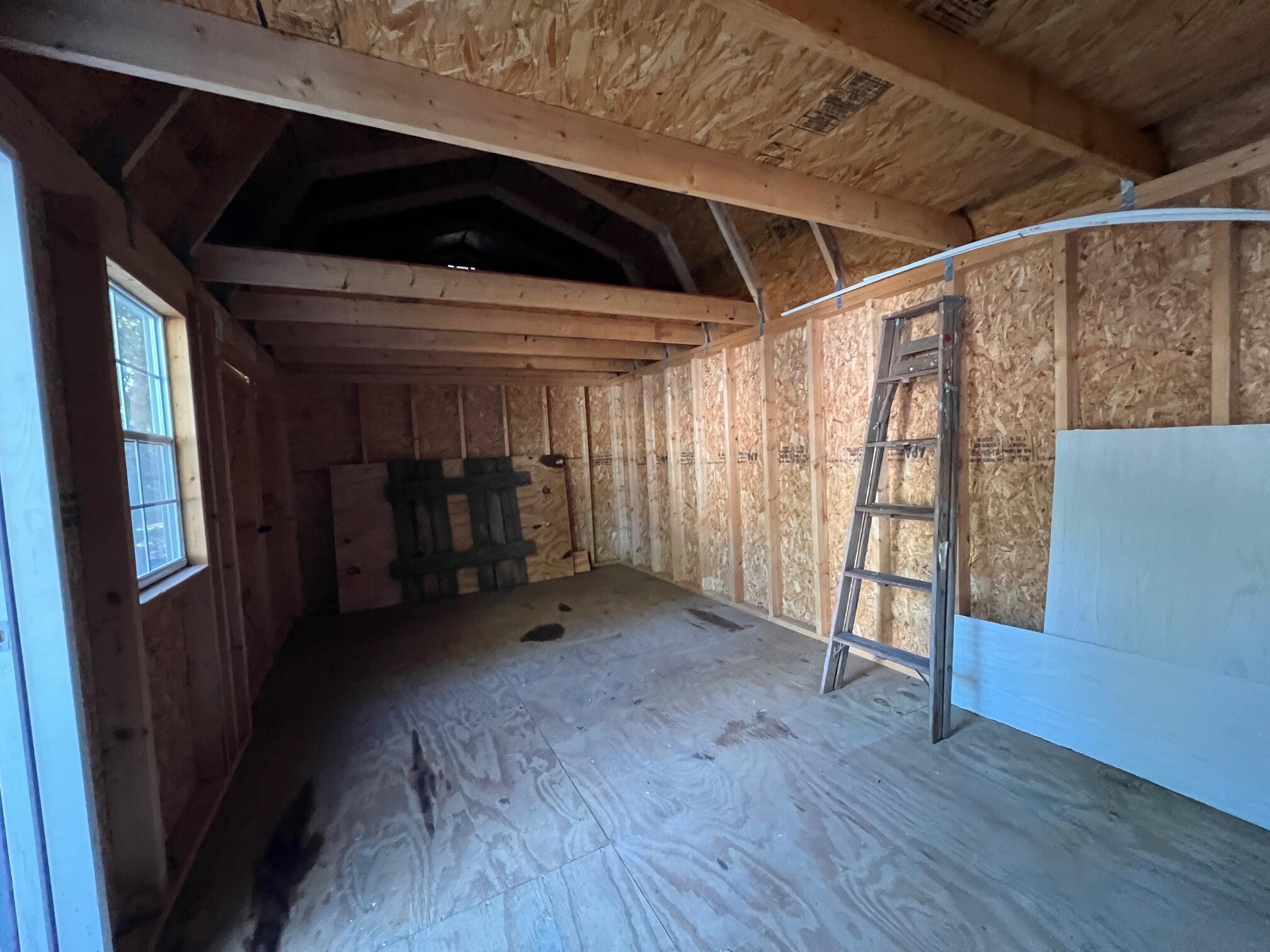 299 Carl Place Crestview, FL 32539 - Photo 4 of 37 a view of an empty room with wooden floor and stairs