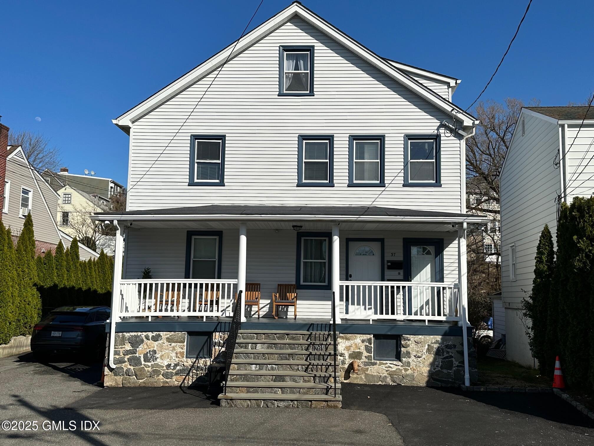 a front view of a house with parking