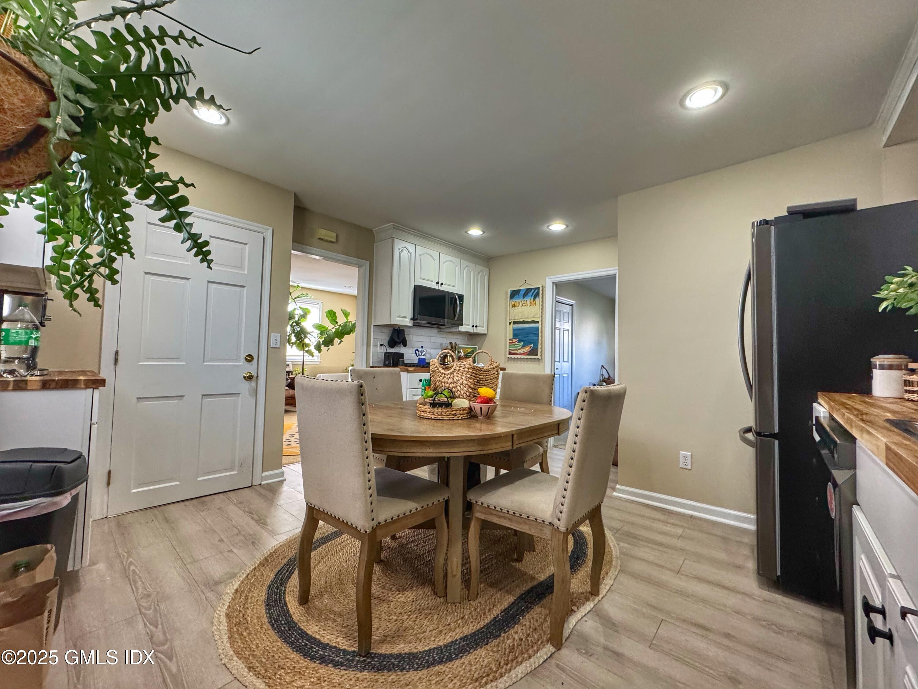37 Gerry Street, Unit 2 Greenwich, CT 06830 - Photo 2 of 13 a view of a dining room with furniture window and wooden floor
