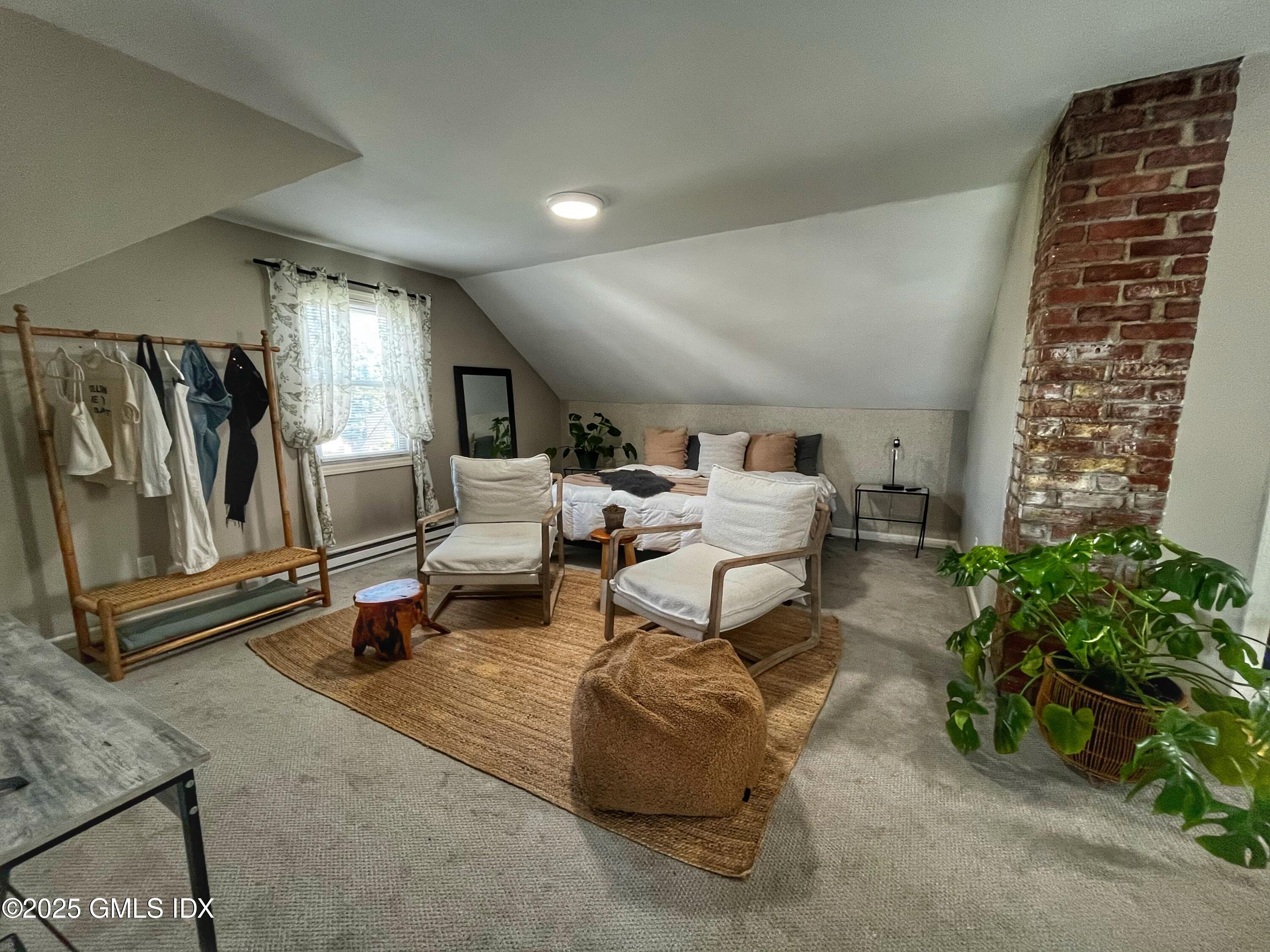 37 Gerry Street, Unit 2 Greenwich, CT 06830 - Photo 3 of 13 a living room with furniture and a potted plant