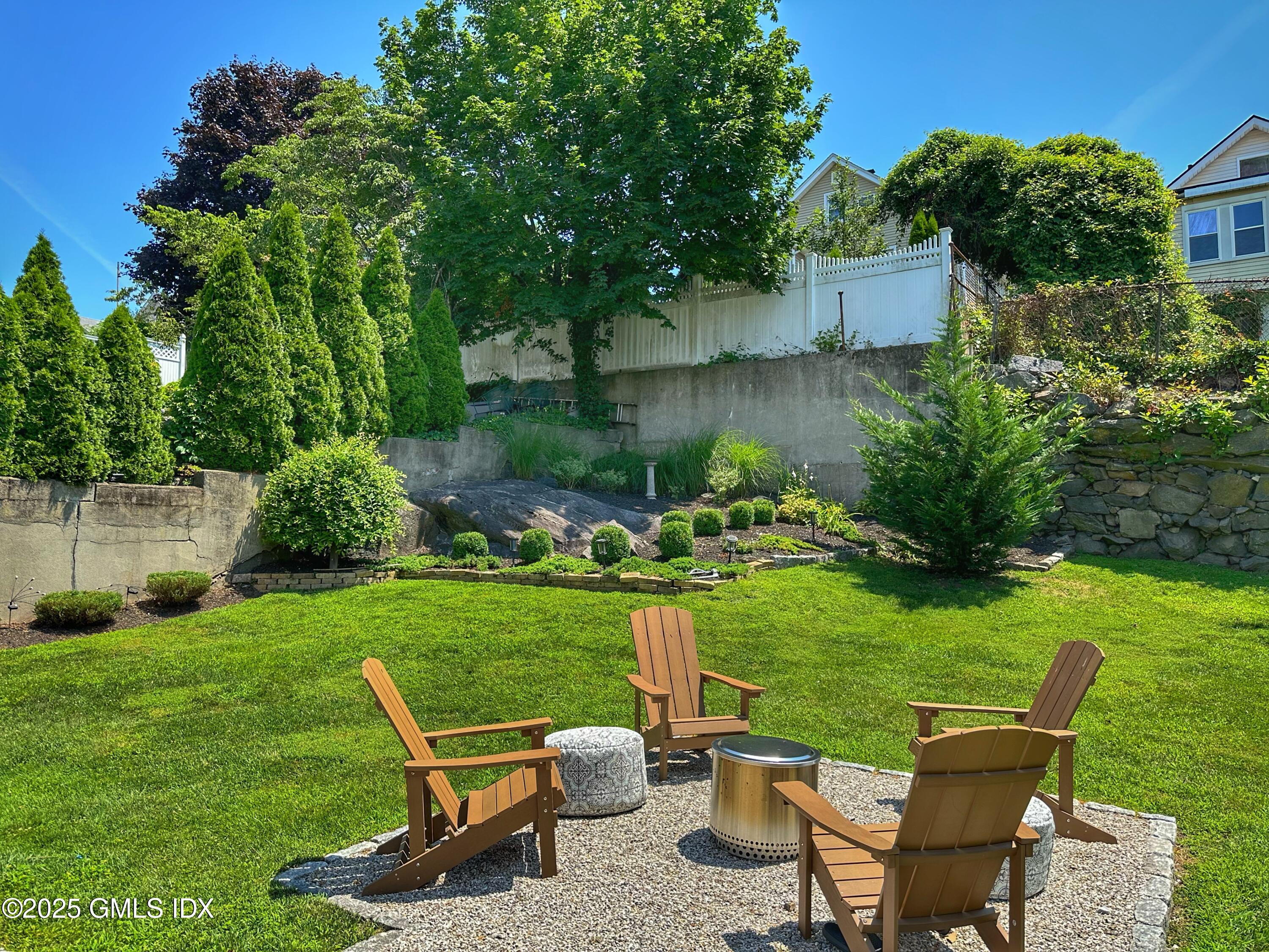 37 Gerry Street, Unit 2 Greenwich, CT 06830 - Photo 10 of 13 a view of a chair and table in the garden