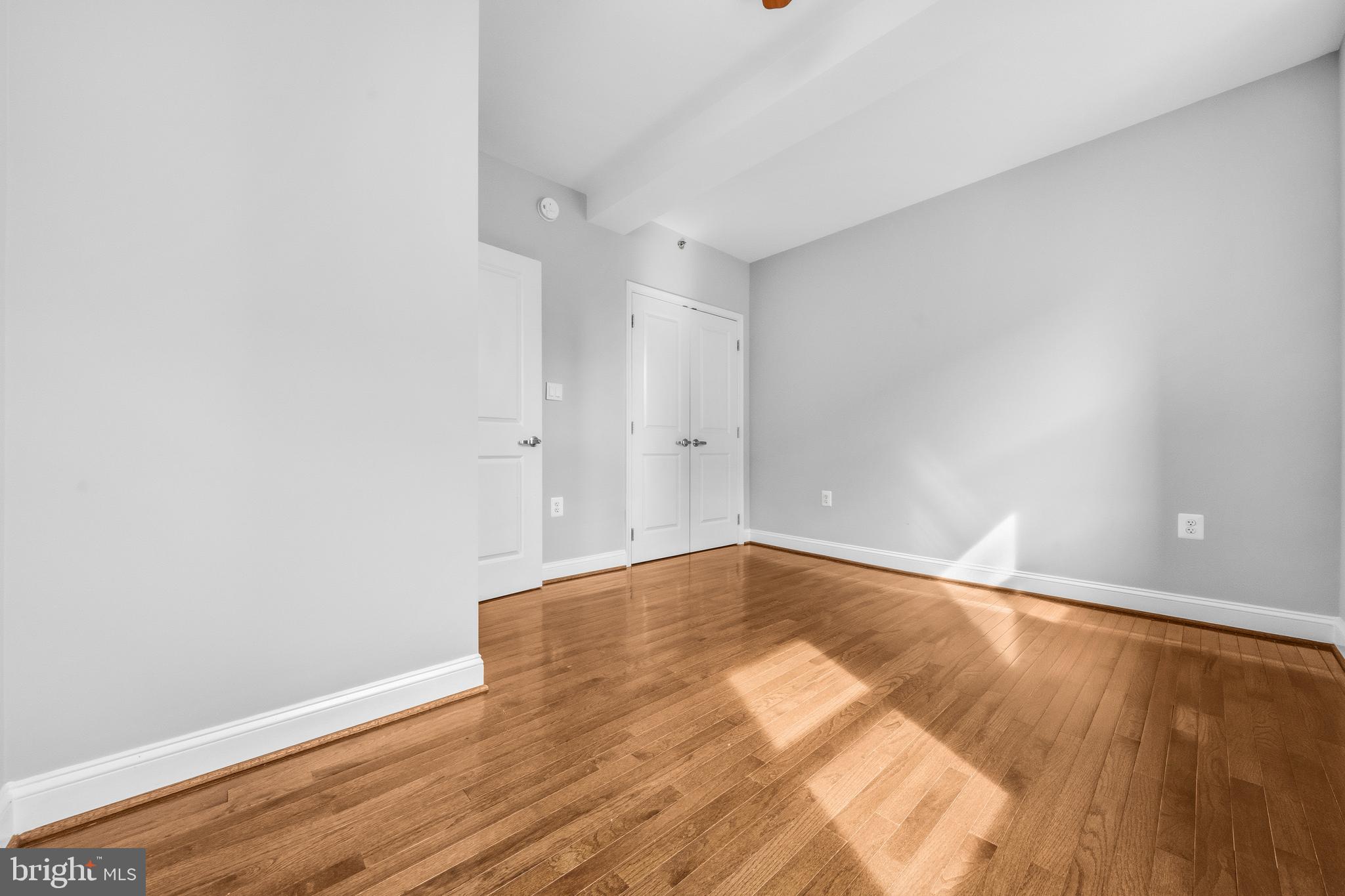 1831 2nd Street Northeast, Unit 207 Washington, DC 20002 - Photo 12 of 33 a view of an empty room with wooden floor