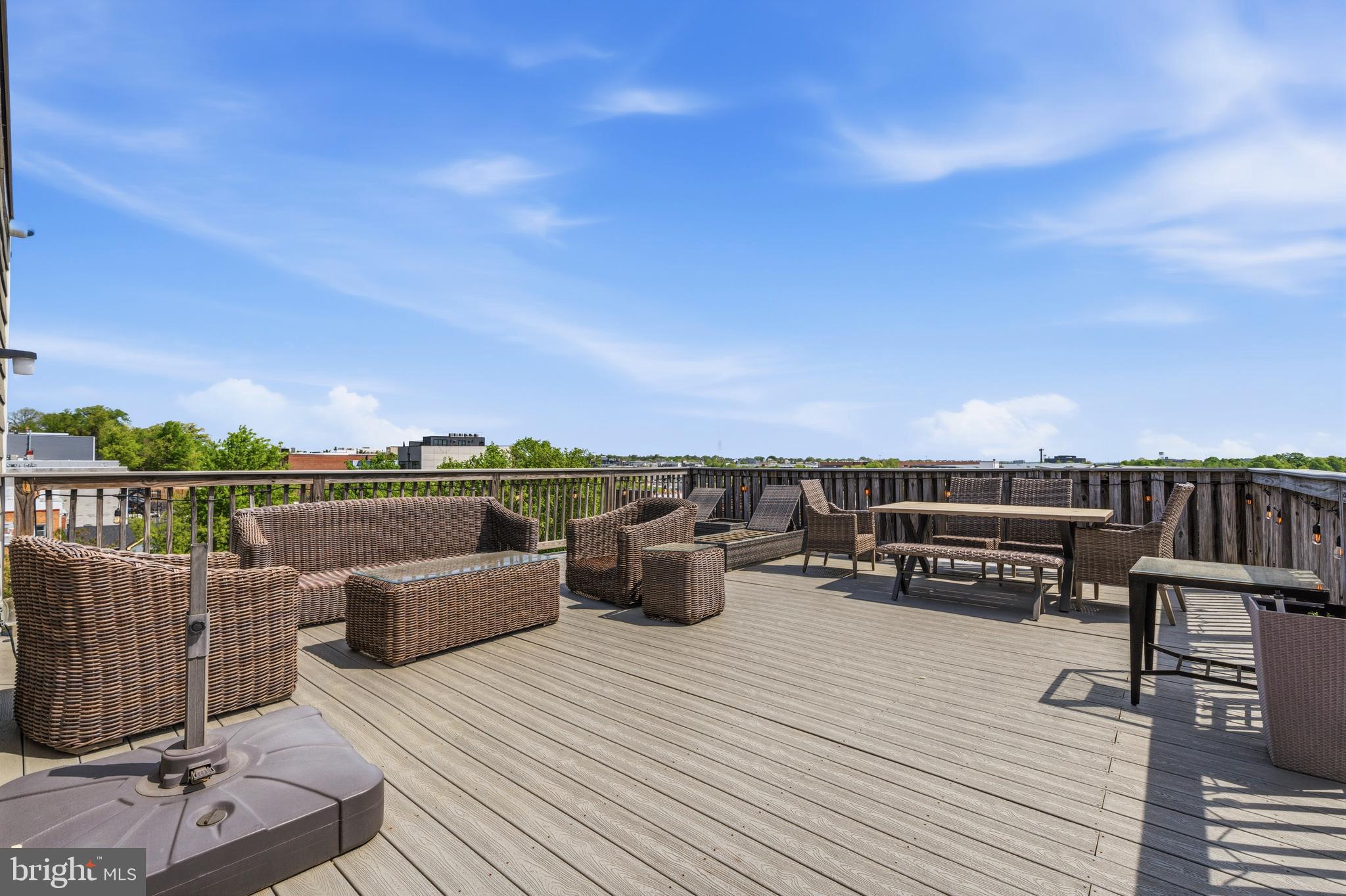 1831 2nd Street Northeast, Unit 207 Washington, DC 20002 - Photo 20 of 33 a view of roof deck with couches and wooden floor