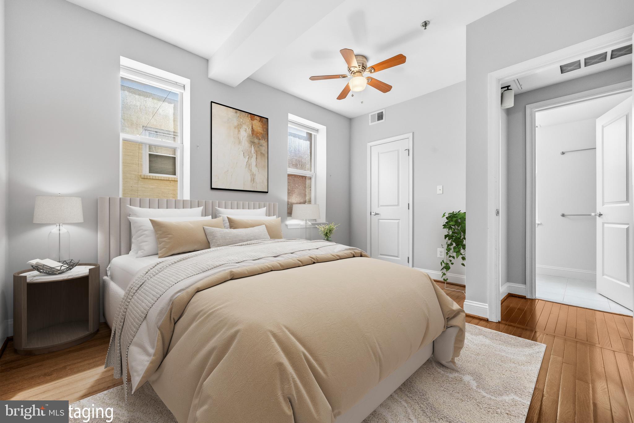 1831 2nd Street Northeast, Unit 207 Washington, DC 20002 - Photo 10 of 33 a bedroom with a bed and a chandelier