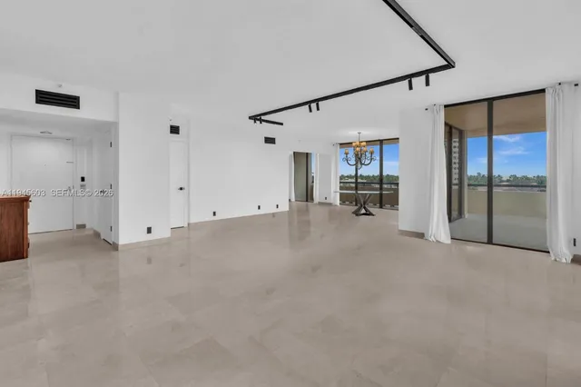 a view of a livingroom with furniture and a flat screen tv