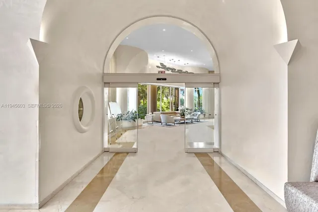 a very nice looking room with a large window and chandelier