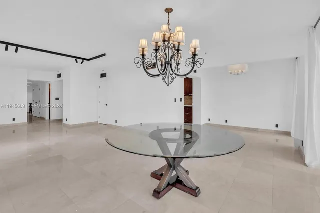 a kitchen with granite countertop a sink stove and cabinets