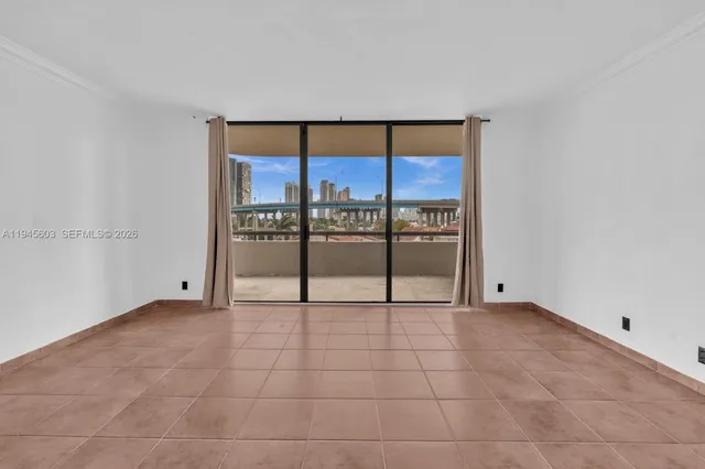 a view of an empty room with a sliding door