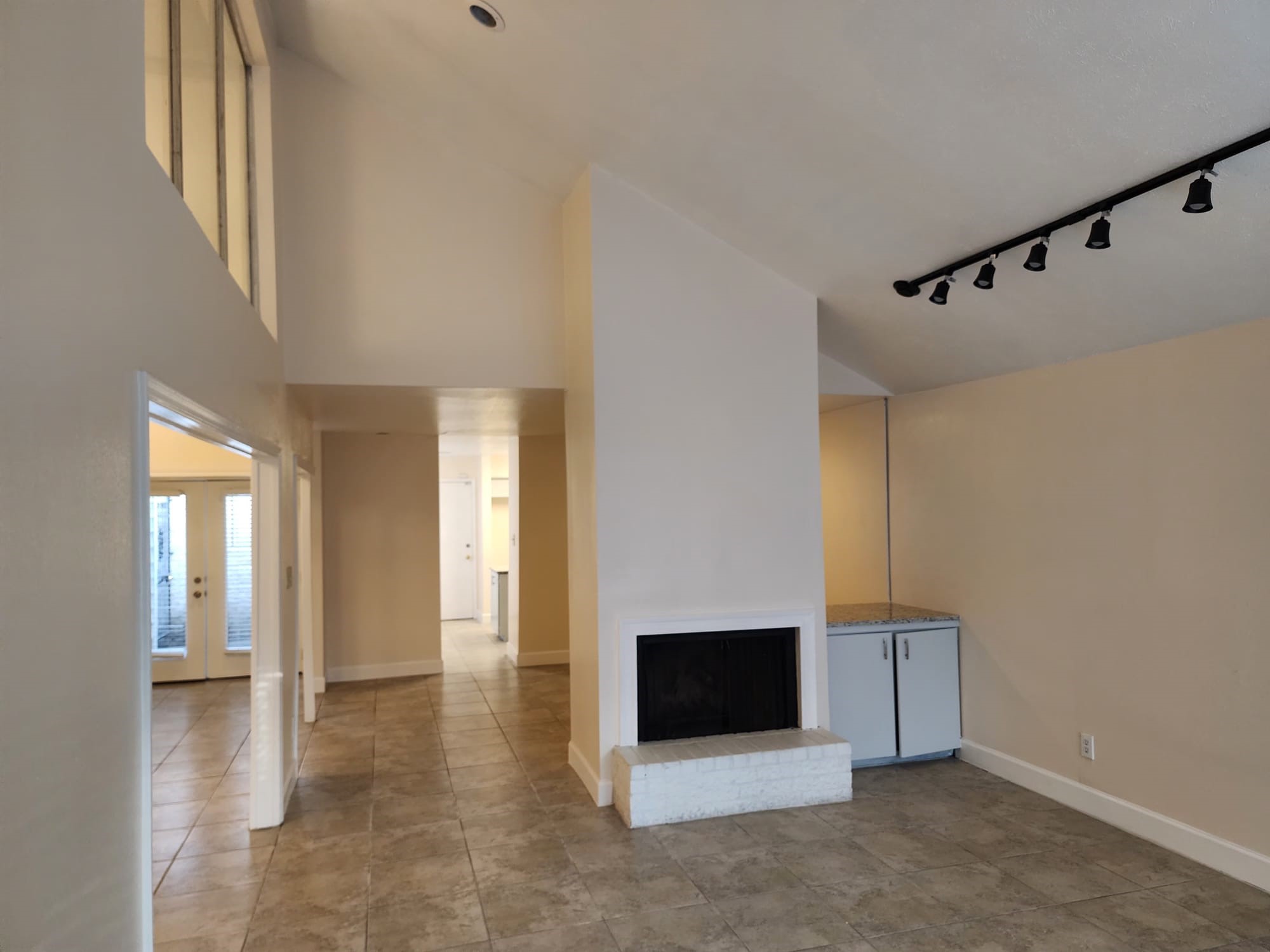 12534 Riva Ridge Lane Missouri City, TX 77071 - Photo 19 of 28 a view of an empty room with wooden floor and a window