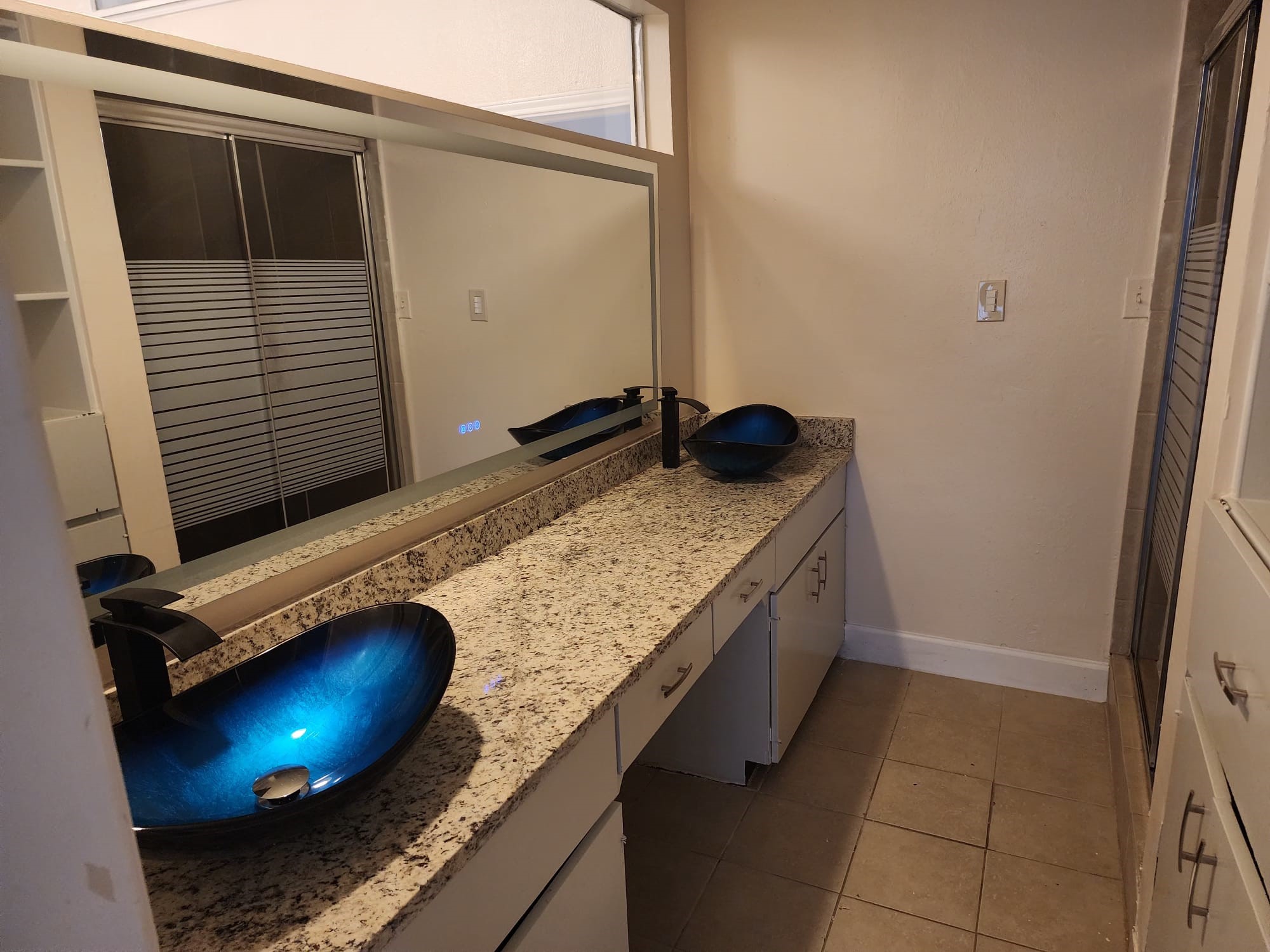 12534 Riva Ridge Lane Missouri City, TX 77071 - Photo 22 of 28 a bathroom with a granite countertop sink and cabinets