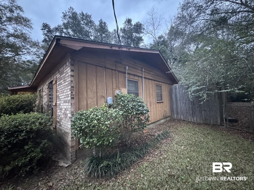 1302 Best Drive Mobile, AL 36608 - Photo 5 of 5 View of property exterior featuring fence