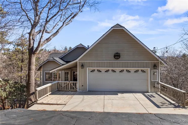 a front view of a house with parking