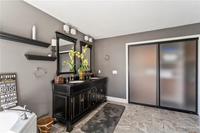 a bedroom with a bed and a mirror