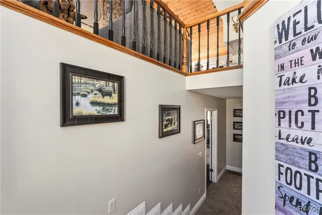 a view of a hallway with paintings on the wall