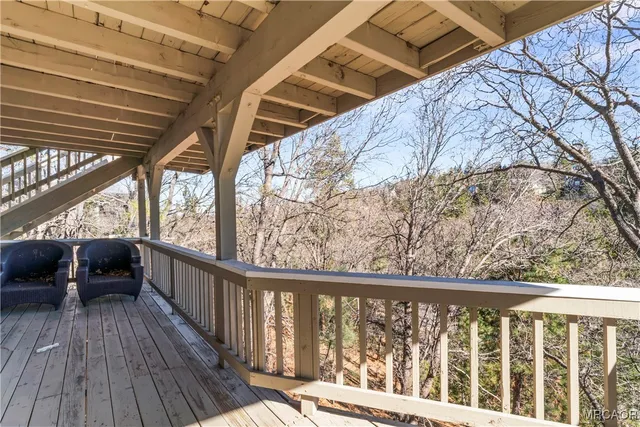a view of balcony with couch and wooden floor