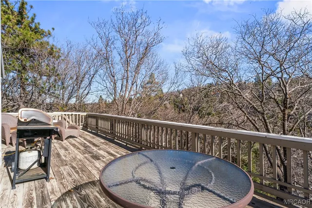 a view of a balcony with furniture
