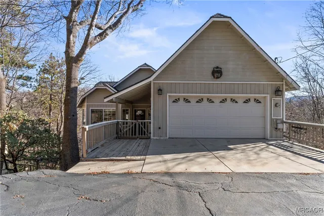 a front view of a house with garage