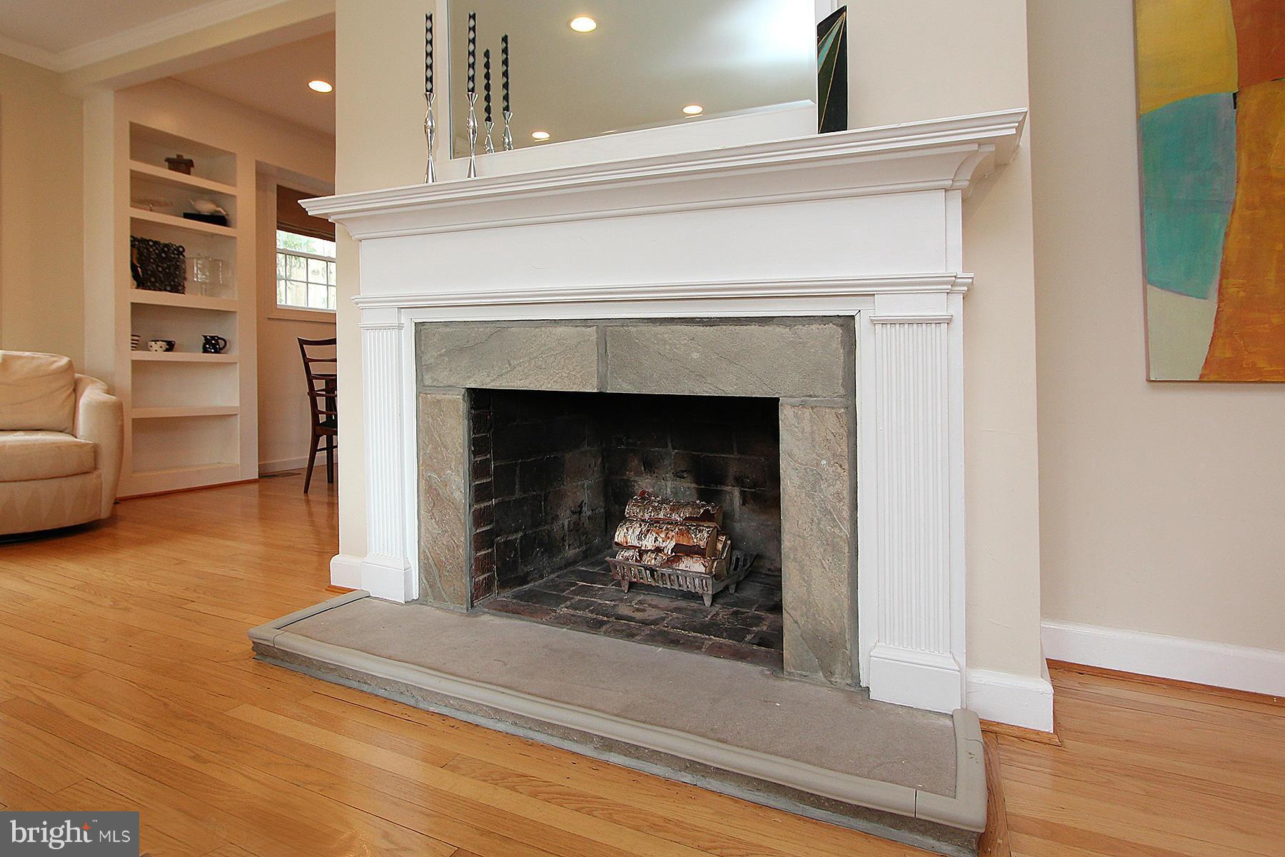 805 Stirling Road Silver Spring, MD 20901 - Photo 11 of 29 a living room with furniture and a fireplace