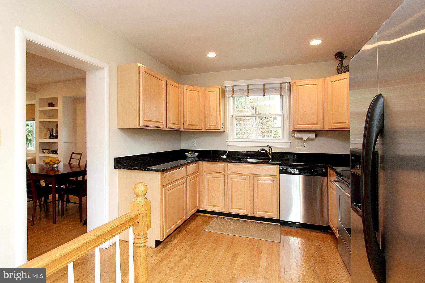 805 Stirling Road Silver Spring, MD 20901 - Photo 17 of 29 a kitchen with stainless steel appliances granite countertop a stove a sink and a refrigerator