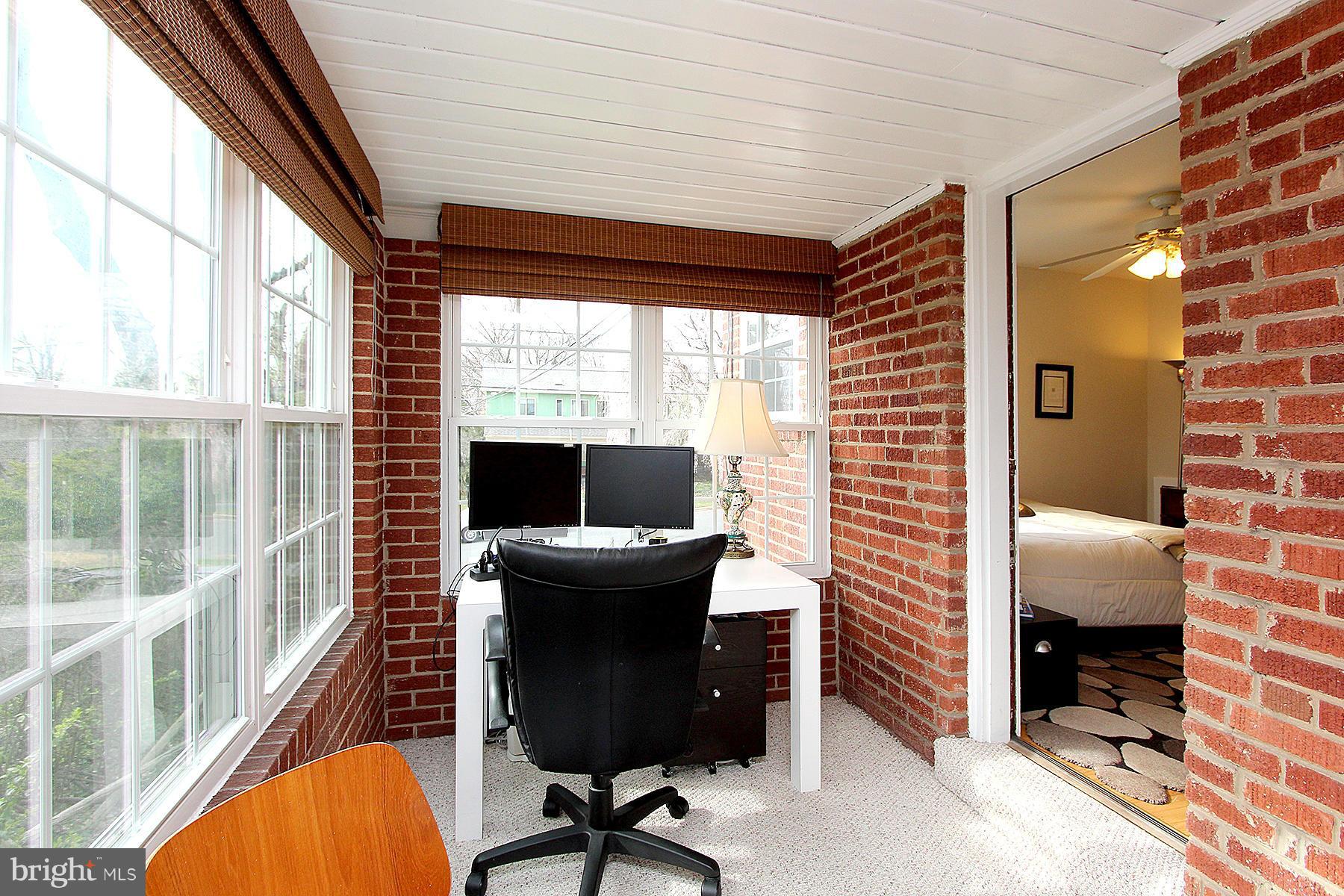 805 Stirling Road Silver Spring, MD 20901 - Photo 24 of 29 a view of a workspace with furniture and a window