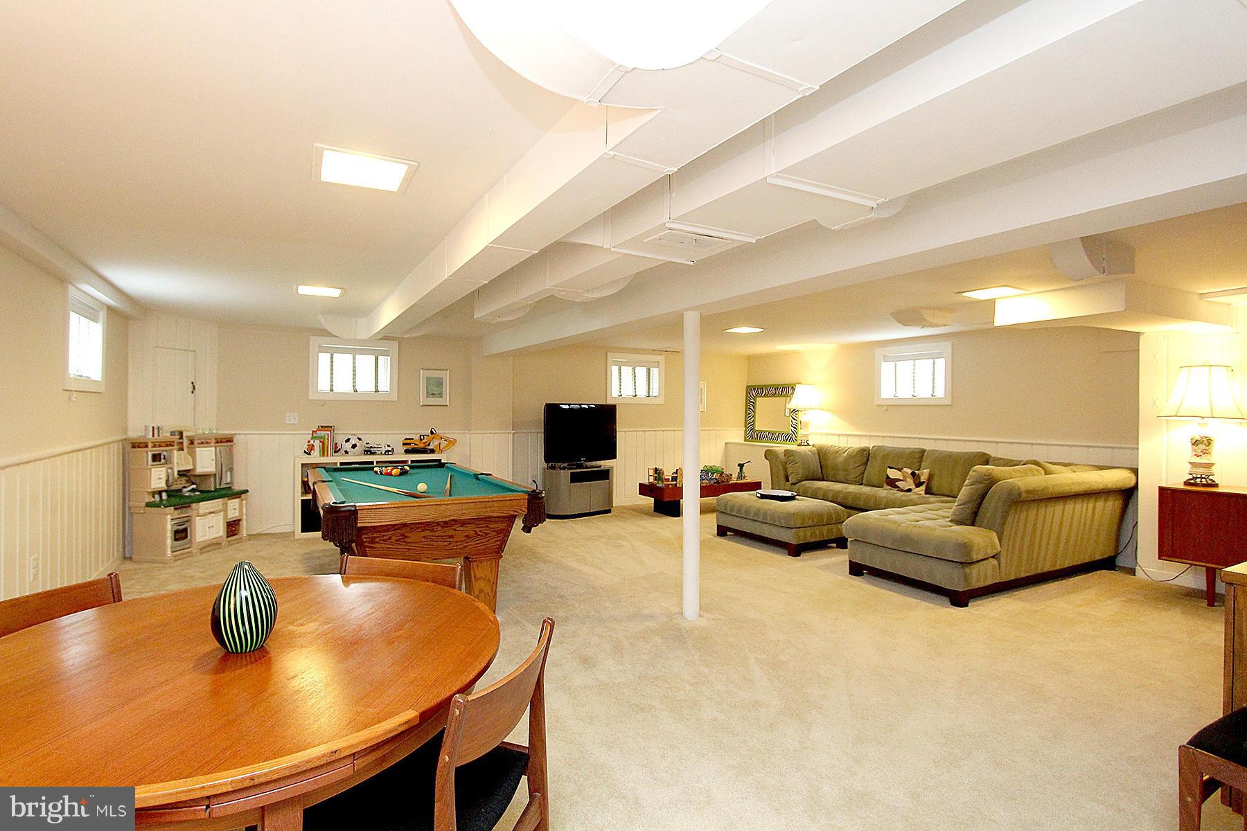 805 Stirling Road Silver Spring, MD 20901 - Photo 28 of 29 a living room with furniture and a table