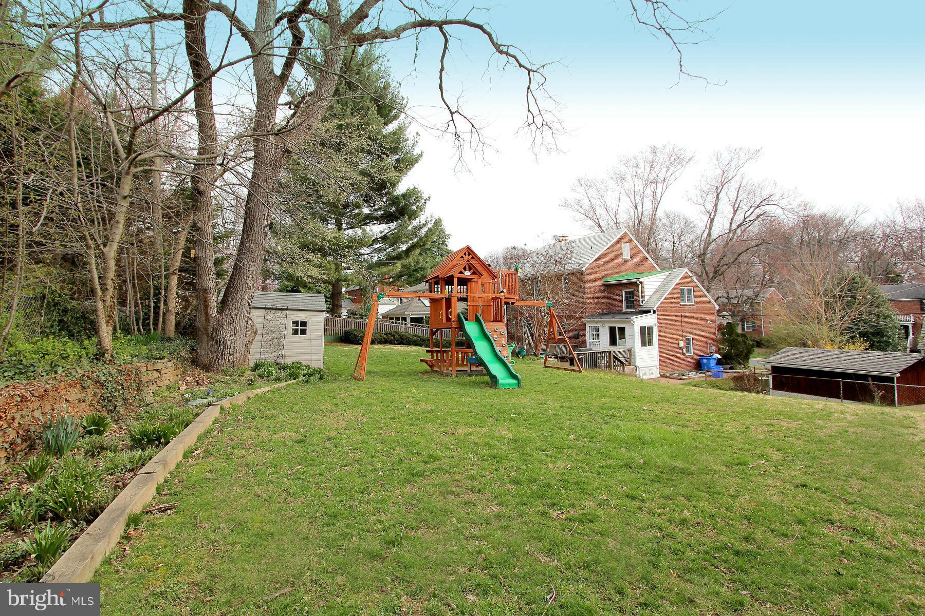 805 Stirling Road Silver Spring, MD 20901 - Photo 29 of 29 a view of a house with a yard and a garage