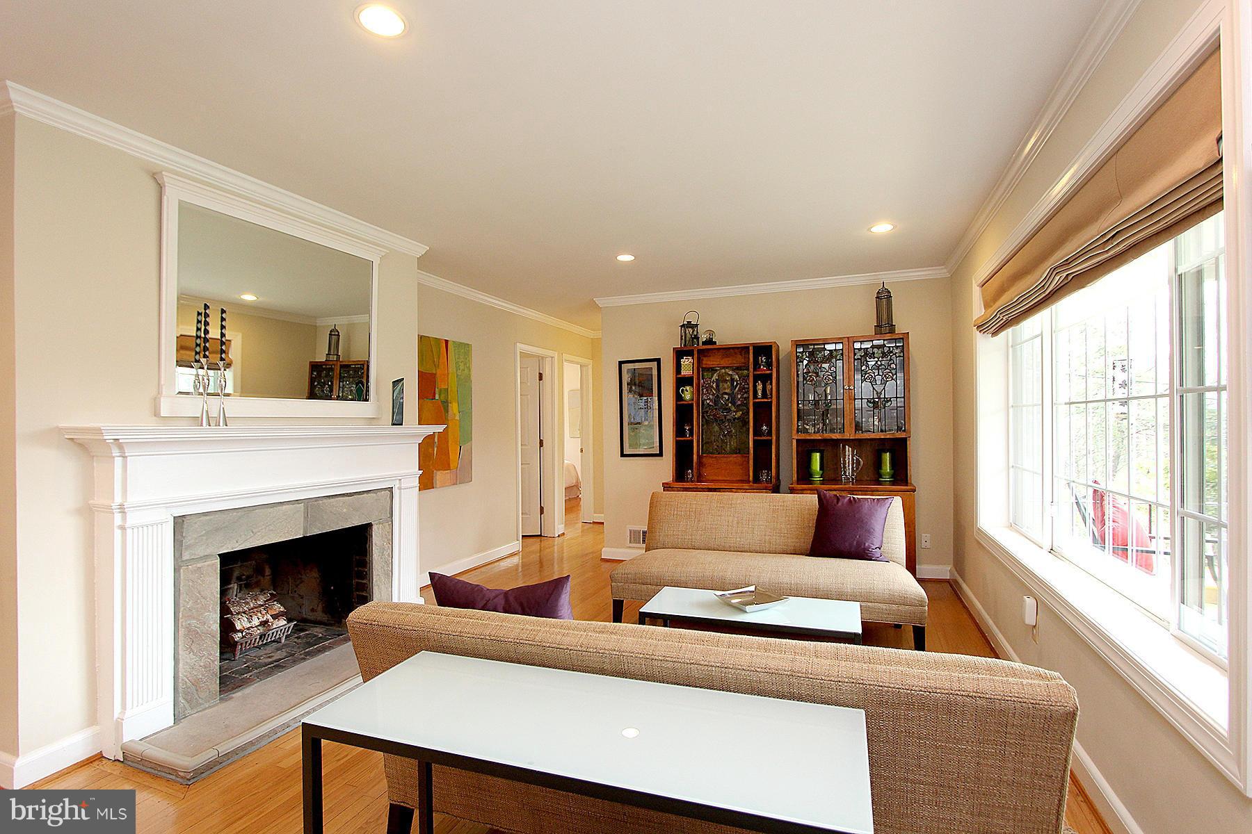 805 Stirling Road Silver Spring, MD 20901 - Photo 6 of 29 a living room with furniture and a fireplace