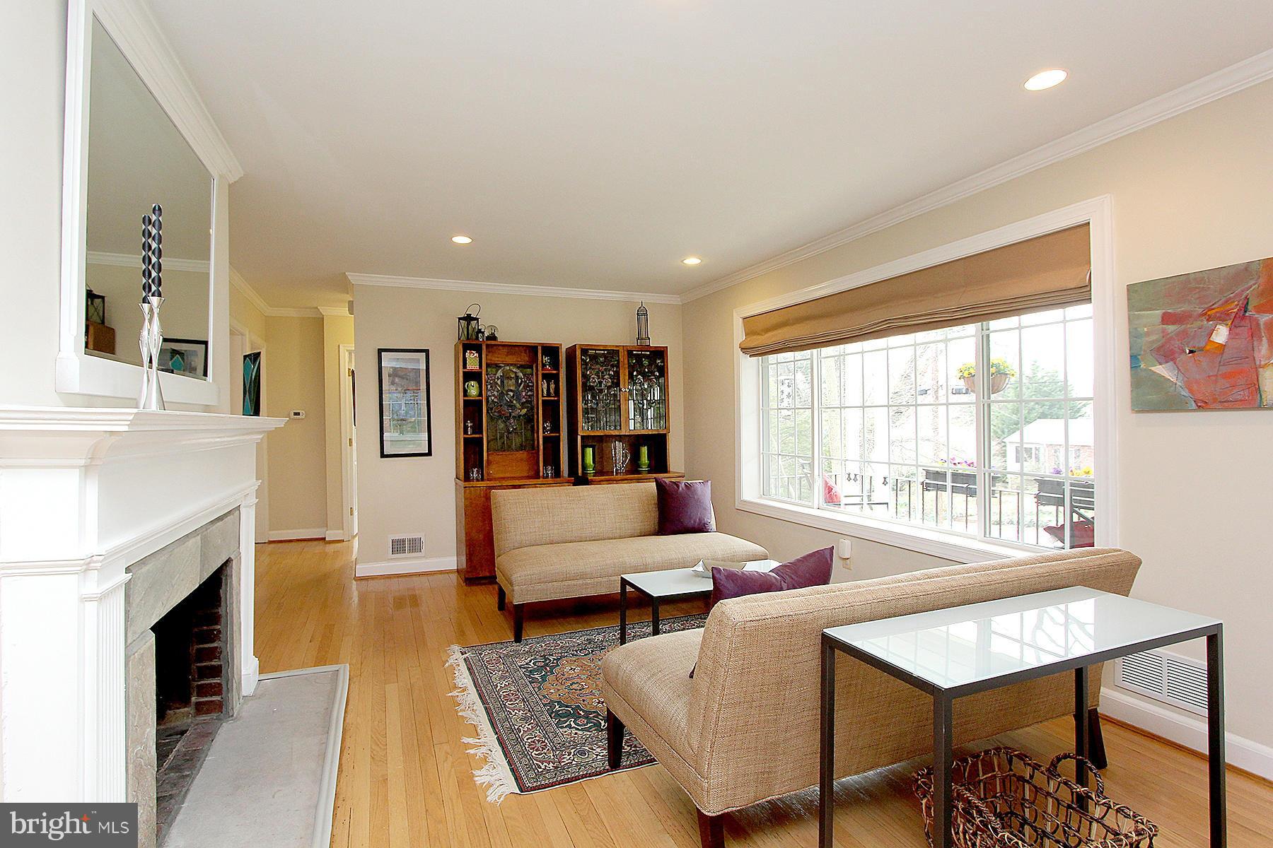 805 Stirling Road Silver Spring, MD 20901 - Photo 7 of 29 a living room with furniture and a fireplace