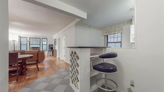 a kitchen with a table and chairs in it