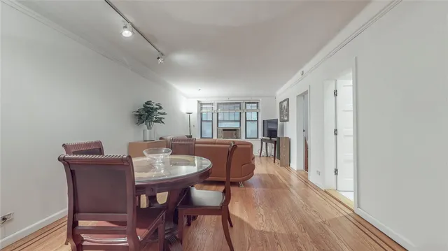 a dining room with furniture and window