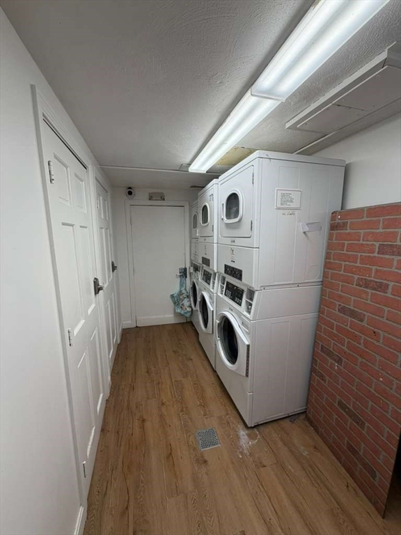 27 Gordon Street, Unit 105 Framingham, MA 01702 - Photo 7 of 7 a view of a storage and utility room with washer and dryer