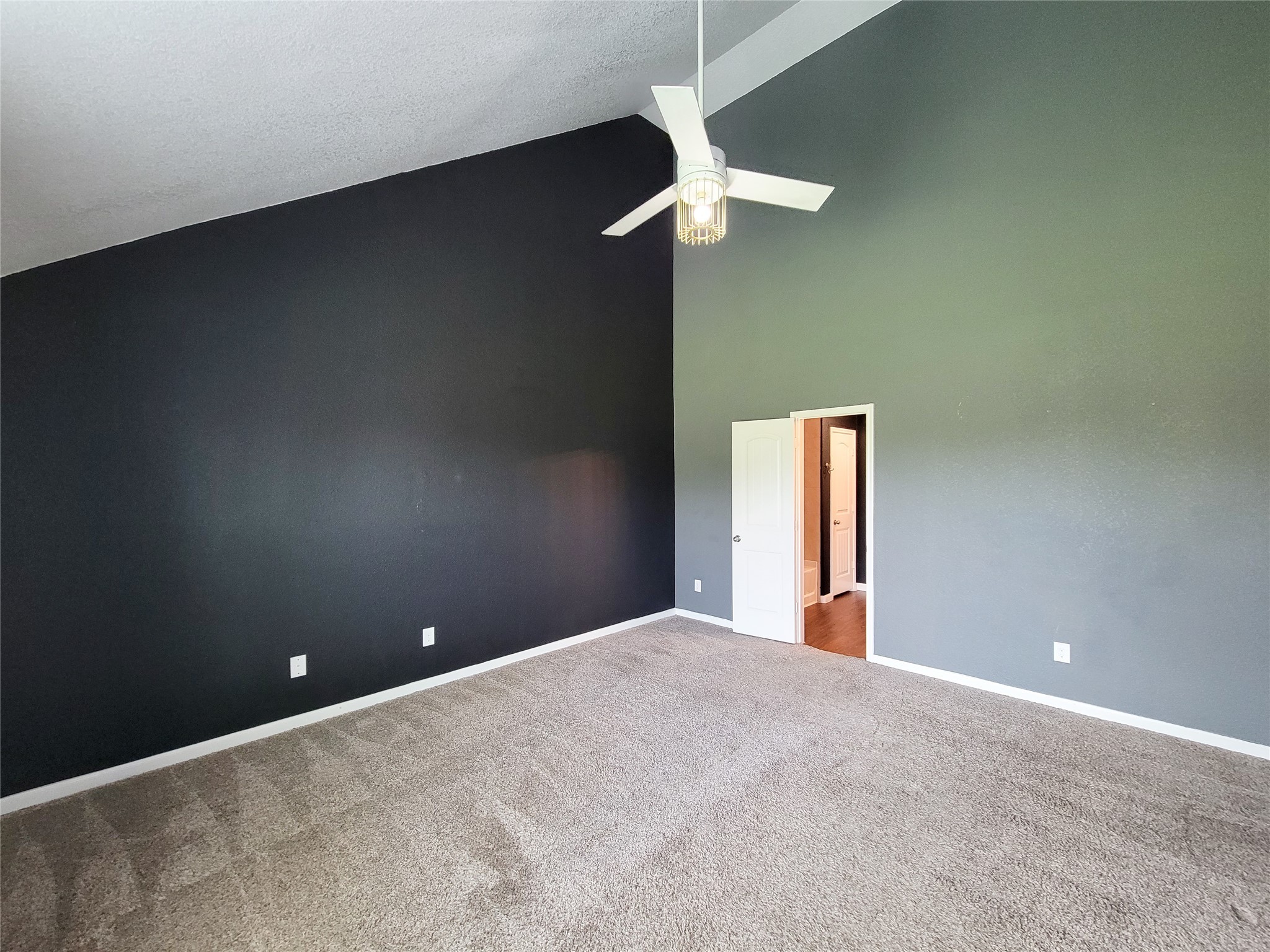 9726 Shimmering Lakes Drive Rosharon, TX 77583 - Photo 19 of 33 a view of an empty room with a chandelier fan