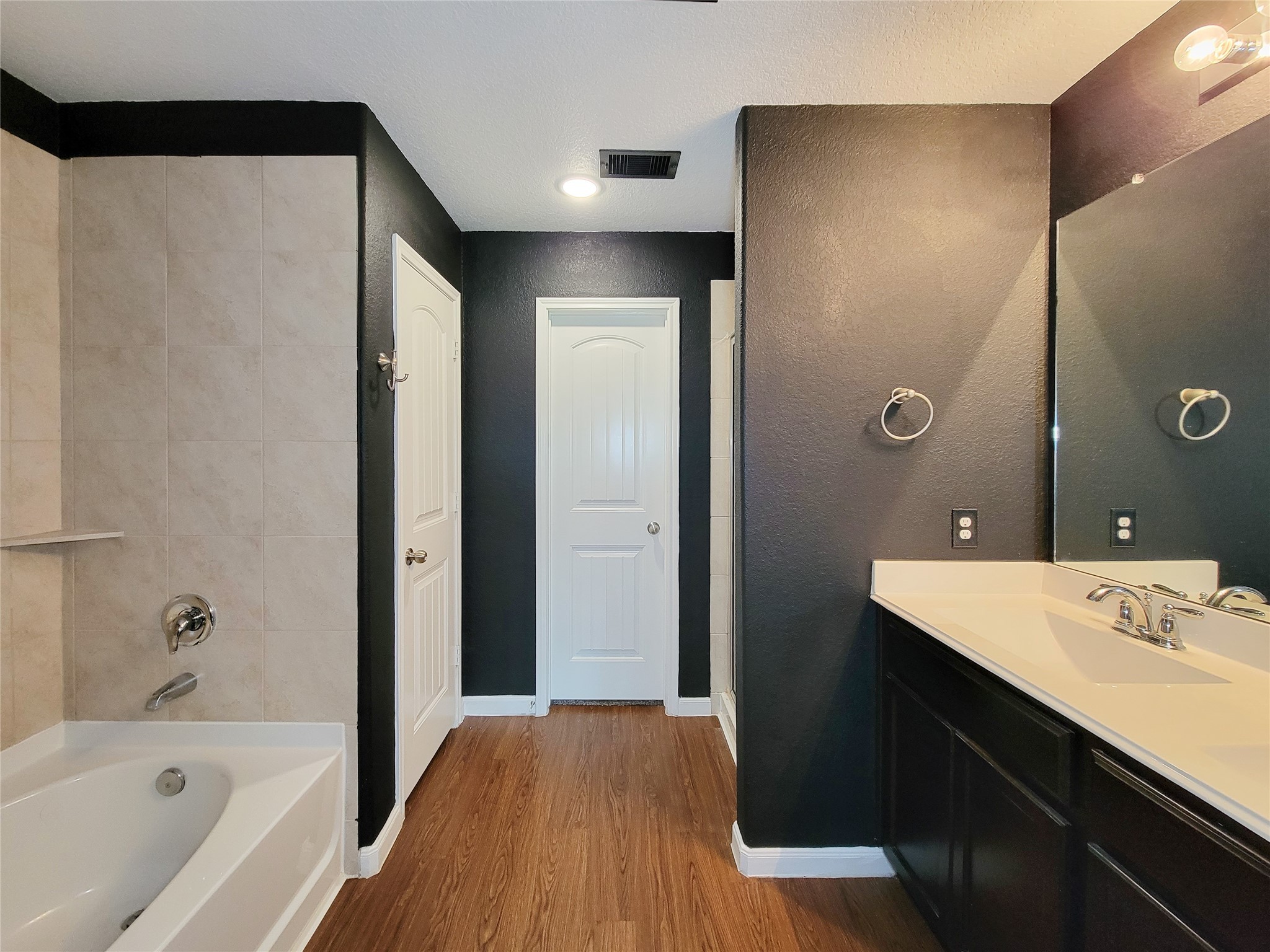 9726 Shimmering Lakes Drive Rosharon, TX 77583 - Photo 20 of 33 a bathroom with a bathtub shower sink vanity and a mirror