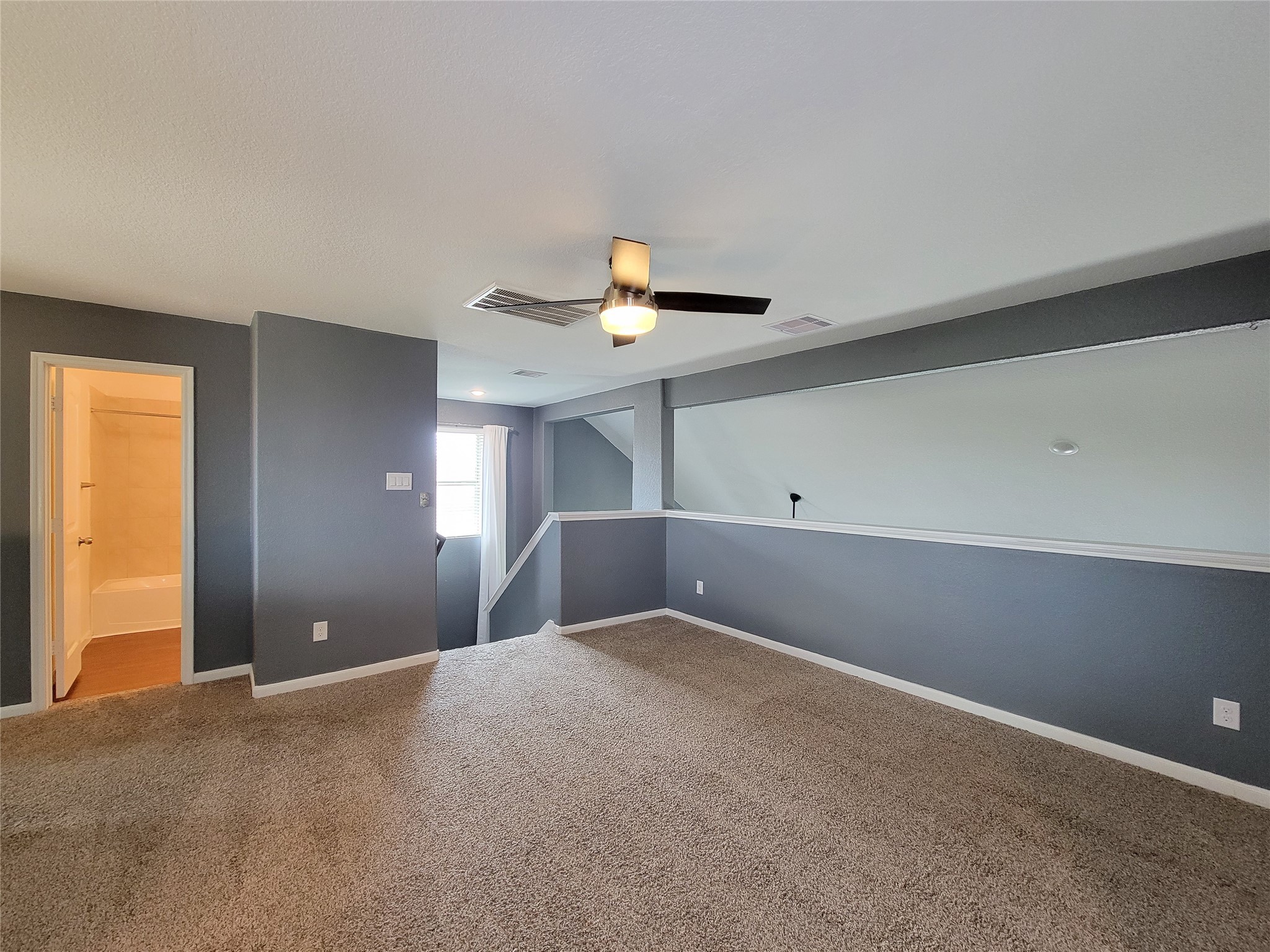 9726 Shimmering Lakes Drive Rosharon, TX 77583 - Photo 25 of 33 a view of a big room with closet and chandelier fan