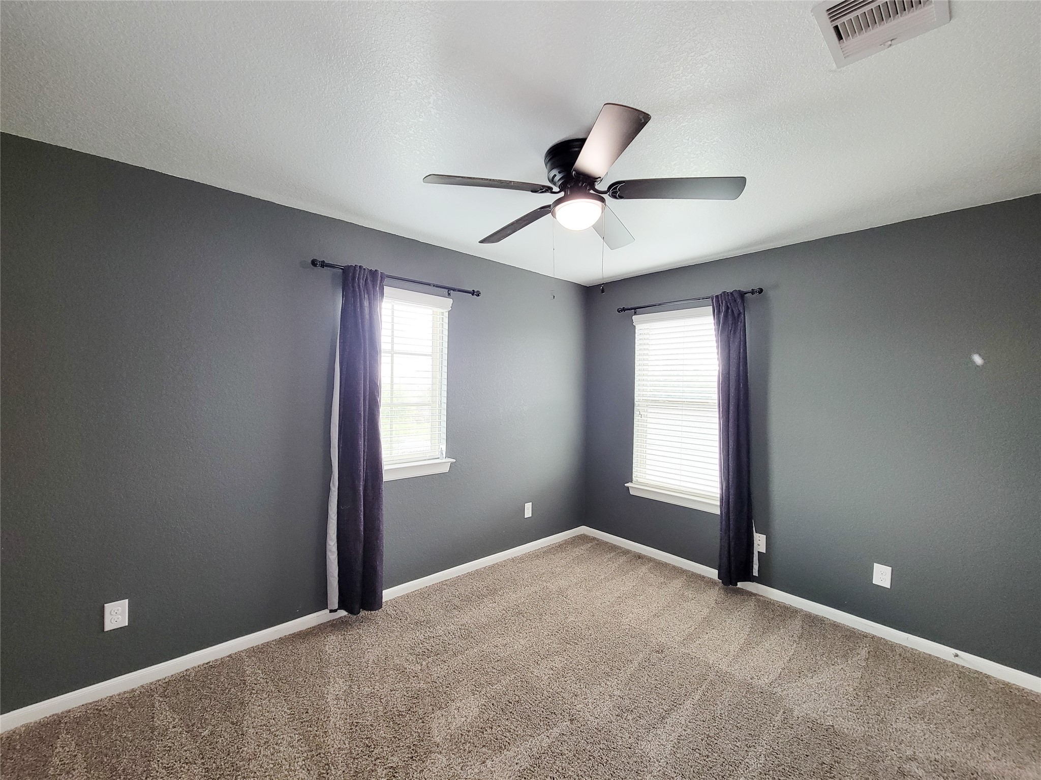 9726 Shimmering Lakes Drive Rosharon, TX 77583 - Photo 27 of 33 a view of empty room with window and ceiling fan