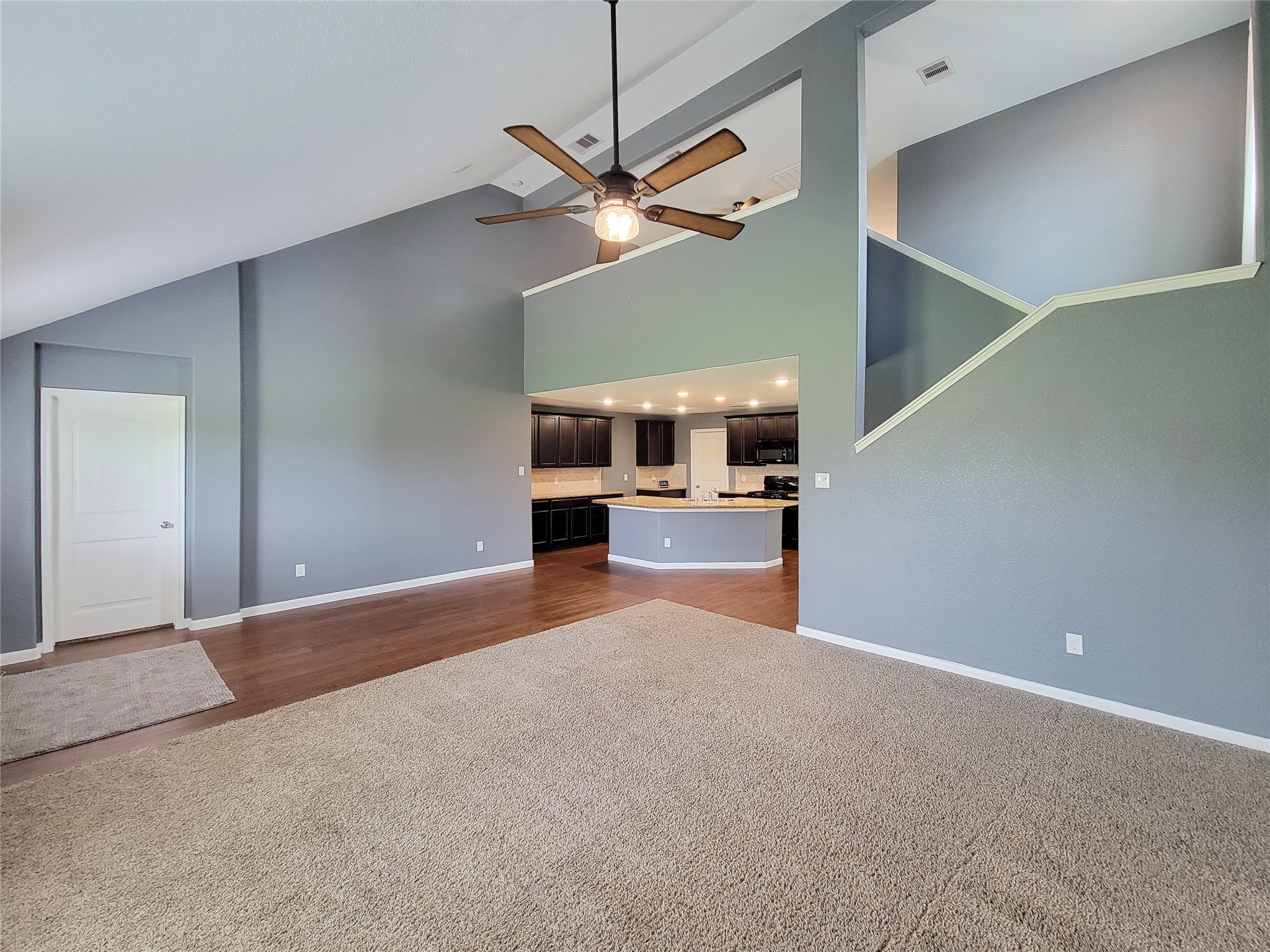 9726 Shimmering Lakes Drive Rosharon, TX 77583 - Photo 9 of 33 a view of a kitchen with a sink and a ceiling fan