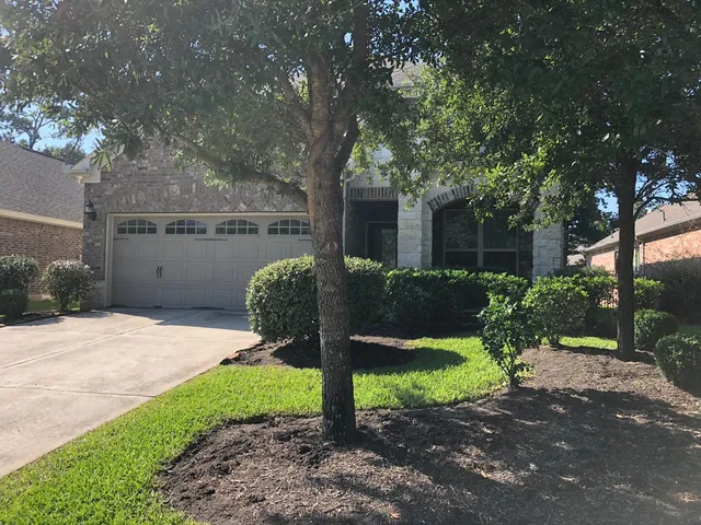 a view of a backyard with a swing
