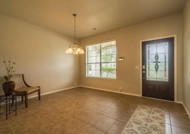 a view of workspace with window and furniture