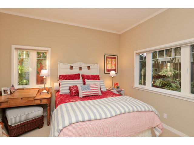 192 Seacliff Drive Aptos, CA 95003 - Photo 20 of 25 a bedroom with a bed and wooden floor