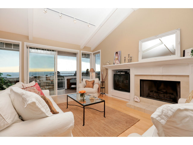 192 Seacliff Drive Aptos, CA 95003 - Photo 4 of 25 a living room with furniture and a fireplace