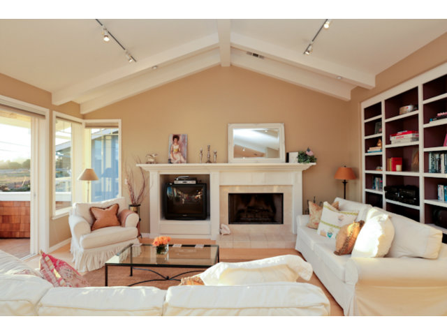 192 Seacliff Drive Aptos, CA 95003 - Photo 6 of 25 a living room with furniture and a fireplace