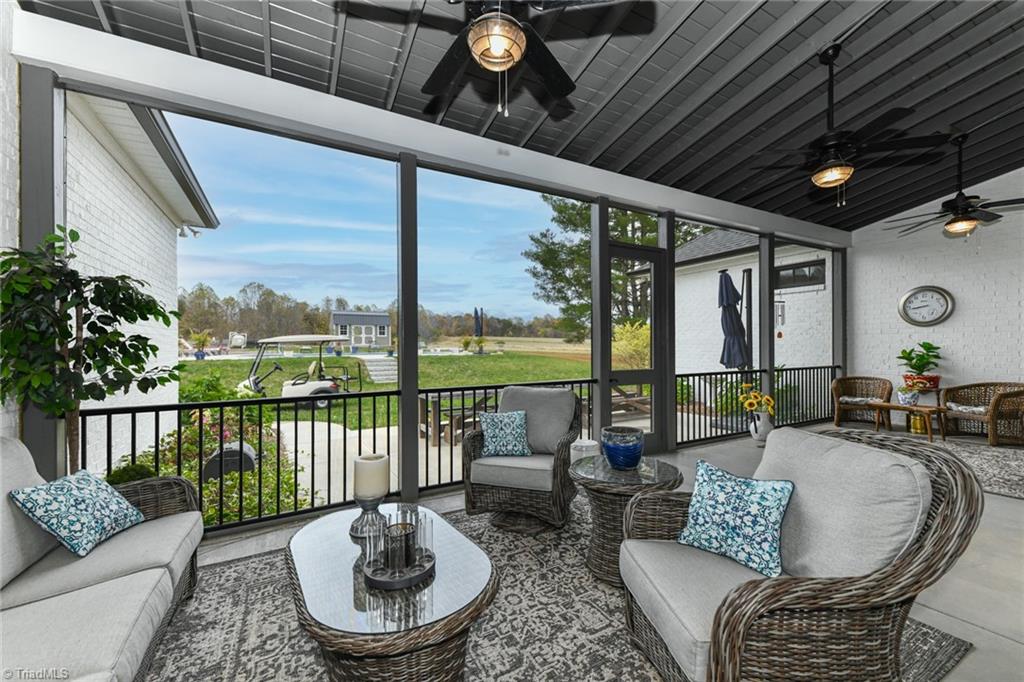 2195 Mizpah Church Road Rural Hall, NC 27045 - Photo 38 of 50 Beautiful, expansive screened porch overlooking fields and inground pool