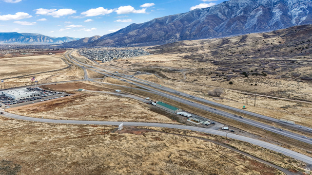 15371 Frontage Road Santaquin, UT 84655 - Photo 3 of 18 Aerial view of a mountainous background