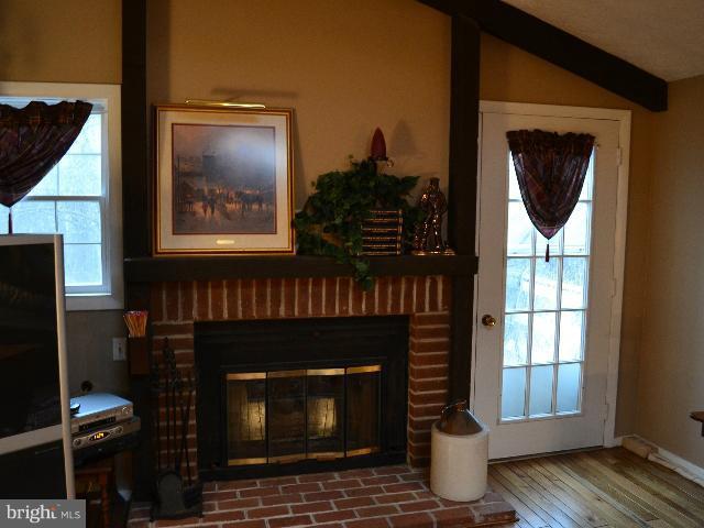 2106 Thomas View Road Reston, VA 20191 - Photo 21 of 29 a living room with furniture and a fireplace
