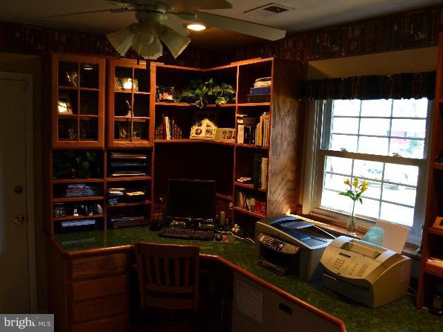 2106 Thomas View Road Reston, VA 20191 - Photo 10 of 29 a room with furniture a flat screen tv and a window